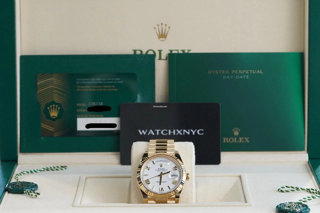 Rolex Day-Date 40 UNWORN DayDate 40mm White Roman Dial Yellow Gold Condition: New | Original box | Original paper